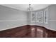 Spacious dining room features hardwood floors, chair rail, and ample natural light at 617 Creekstone Ct, Jonesboro, GA 30236