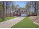 Traditional two-story brick home featuring a driveway leading to an attached two-car garage at 617 Creekstone Ct, Jonesboro, GA 30236