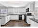 Well-lit kitchen with white cabinets, granite countertops, and stainless steel appliances at 617 Creekstone Ct, Jonesboro, GA 30236