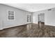 Living room with french doors and a window, complemented by neutral walls and vinyl plank flooring at 617 Creekstone Ct, Jonesboro, GA 30236