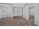 Finished basement area with tile flooring and multiple entryways at 8633 Hilltop Rd, Jonesboro, GA 30236