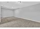 Basement area with carpet flooring and ample space for storage at 8633 Hilltop Rd, Jonesboro, GA 30236