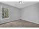 A bedroom featuring a large window bringing in natural light at 8633 Hilltop Rd, Jonesboro, GA 30236