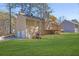 A multi-level home featuring a two-car garage and outdoor deck at 8633 Hilltop Rd, Jonesboro, GA 30236