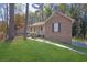 Charming brick and siding home with a well-maintained front yard and covered porch at 8633 Hilltop Rd, Jonesboro, GA 30236