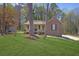 Charming brick and siding home with a well-maintained front yard and covered porch at 8633 Hilltop Rd, Jonesboro, GA 30236