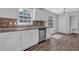 Charming kitchen featuring sleek stainless-steel appliances and new countertops at 8633 Hilltop Rd, Jonesboro, GA 30236