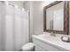 Bathroom featuring a white vanity with a framed mirror and a white shower curtain over the bathtub at 1929 Finnish Ln, Kennesaw, GA 30152
