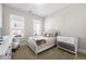 Cozy bedroom with neutral walls, plush carpet, ample natural light, and crib at 1929 Finnish Ln, Kennesaw, GA 30152
