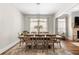 Elegant dining room features a modern chandelier, hardwood floors and neutral paint at 1929 Finnish Ln, Kennesaw, GA 30152