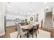 Dining area features a staircase, wood floors, and seamless flow into the gourmet kitchen at 1929 Finnish Ln, Kennesaw, GA 30152