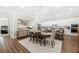 Open-concept dining area with modern chandelier, seamlessly connecting to the kitchen and living spaces at 1929 Finnish Ln, Kennesaw, GA 30152