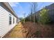 Exterior view of home showcasing lush landscaping and mature trees that enhance outdoor aesthetics at 1929 Finnish Ln, Kennesaw, GA 30152