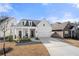 Charming home with a two-car garage, stone accents, and a meticulously maintained front lawn at 1929 Finnish Ln, Kennesaw, GA 30152