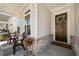 Inviting front porch with seating area, decorative brick accents, and a welcoming wreath on the front door at 1929 Finnish Ln, Kennesaw, GA 30152