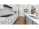 Modern kitchen featuring sleek white cabinetry, stainless appliances, and a functional island at 1929 Finnish Ln, Kennesaw, GA 30152