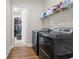 Efficient laundry room equipped with modern, stainless-steel washer and dryer set at 1929 Finnish Ln, Kennesaw, GA 30152