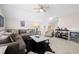 Inviting living room featuring a sectional sofa, armchair, sleek coffee table, and a stylish bar area at 1929 Finnish Ln, Kennesaw, GA 30152