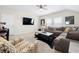 Spacious living room with a comfortable sectional sofa, patterned armchairs, TV, and a modern coffee table at 1929 Finnish Ln, Kennesaw, GA 30152