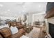 Open-concept living area offering fireplace, comfortable seating and views of the kitchen and dining area at 1929 Finnish Ln, Kennesaw, GA 30152