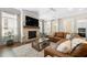 Comfortable living room showcasing a fireplace, TV, and ample seating with plenty of natural light at 1929 Finnish Ln, Kennesaw, GA 30152