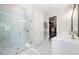 Bathroom features tiled walk-in shower and a double sink vanity with modern fixtures at 1929 Finnish Ln, Kennesaw, GA 30152