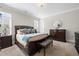 Serene bedroom featuring a luxurious bed, a chandelier, and a dresser at 1929 Finnish Ln, Kennesaw, GA 30152