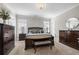 The main bedroom features a king bed, neutral carpet, and classic, dark-wood furnishings at 1929 Finnish Ln, Kennesaw, GA 30152