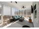 Bright sunroom featuring comfortable seating, ceiling fan, and lovely outdoor views at 1929 Finnish Ln, Kennesaw, GA 30152