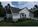 Charming home with white siding, dark roof, lush landscaping, and inviting curb appeal, perfect for modern living at 237 Barbara Sw Ln, Mableton, GA 30126