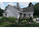 Beautiful home featuring white siding, stone accents, covered patio, and well-maintained lawn, offering a serene outdoor space at 237 Barbara Sw Ln, Mableton, GA 30126