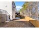 Back yard features a walkout basement, deck, retaining wall, and a newly-fenced yard at 2517 Hampton Park Ct, Marietta, GA 30062