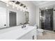 Bright bathroom with double vanity, sleek fixtures, a large mirror, and glass walk-in shower at 2517 Hampton Park Ct, Marietta, GA 30062