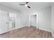 Spacious bedroom featuring hardwood floors, neutral paint, and a view into an adjoining bathroom at 2517 Hampton Park Ct, Marietta, GA 30062