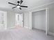 Bright bedroom with soft carpet, a ceiling fan, closet and ensuite bathroom at 2517 Hampton Park Ct, Marietta, GA 30062