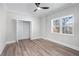 Bright bedroom featuring wood flooring, neutral paint, a closet, and natural light from the window at 2517 Hampton Park Ct, Marietta, GA 30062