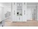 Butler's pantry features white cabinets, wine rack, marble countertops, and view of staircase at 2517 Hampton Park Ct, Marietta, GA 30062