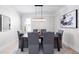 Formal dining room with a modern chandelier, stylish decor, and neutral color palette at 2517 Hampton Park Ct, Marietta, GA 30062