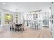 Bright kitchen with modern finishes including white cabinets, stainless appliances, and dining area at 2517 Hampton Park Ct, Marietta, GA 30062
