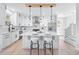 Open kitchen features white cabinets, stainless steel appliances, and marble countertops with barstool seating at 2517 Hampton Park Ct, Marietta, GA 30062