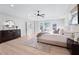 A serene main bedroom features hardwood floors, a ceiling fan, and tray ceiling at 2517 Hampton Park Ct, Marietta, GA 30062