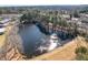 Scenic aerial view of a serene pond surrounded by trees, with a small dock extending into the water at 2517 Hampton Park Ct, Marietta, GA 30062