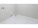 Empty room features neutral paint, tile flooring, and utility connections at 2517 Hampton Park Ct, Marietta, GA 30062
