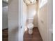 Small bathroom with a toilet and painted cinder block walls at 2628 Miriam Ln, Decatur, GA 30032