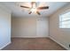 Neutral bedroom with a ceiling fan, carpeted floors, and closet at 2628 Miriam Ln, Decatur, GA 30032