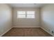 Bedroom with neutral walls, carpet flooring, and a window at 2628 Miriam Ln, Decatur, GA 30032
