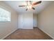 Neutral bedroom with a ceiling fan, carpeted floors, and closet at 2628 Miriam Ln, Decatur, GA 30032