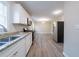 Updated kitchen featuring stainless steel appliances and granite countertops overlooking an adjacent dining area at 2628 Miriam Ln, Decatur, GA 30032