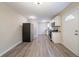 A well lit kitchen featuring stainless steel appliances, granite countertops, and durable laminate flooring at 2628 Miriam Ln, Decatur, GA 30032