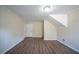 Room featuring wood flooring, neutral colored walls, and a door at 2628 Miriam Ln, Decatur, GA 30032
